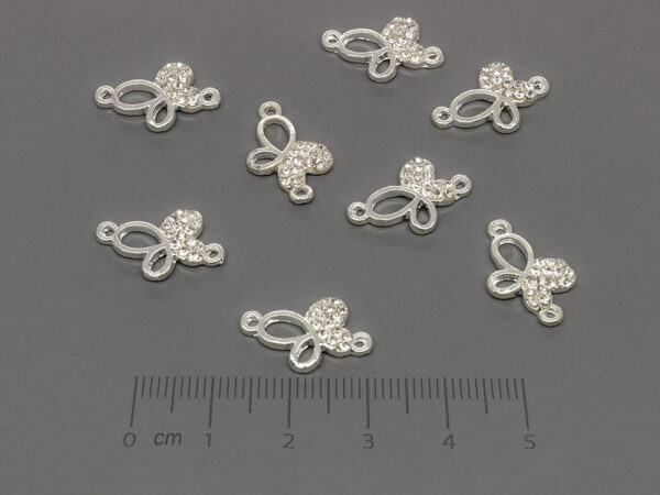 Пеперуда с камъни 17.5x12mm, отвор халки 1.2mm - 50 бр.